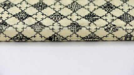 simple blackwork embroidery on pale yellow even-weave cloth on a white background - book-covers