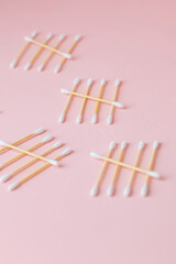 environmentally friendly bamboo and cotton cotton buds on a pink background, bamboo toothbrushes for adults and children. human personal hygiene products without harming the environment, biodegradable