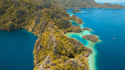 Aerial view mountain Barracuda lake, on tropical island, Lagoon with blue, azure water. Lake in the mountains covered with tropical forest on the island Coron, Palawan, Philippines.