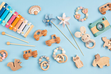 Eco fiendly child wooden toys. Sustainable, developmental, sensory toys for babies and toddlers. Top view, flat lay - obrazy, fototapety, plakaty