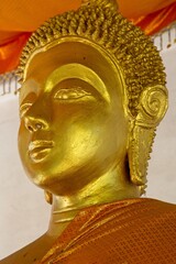 Closeup of golden statute of buddha head in monastry Luang Prabang, Laos.