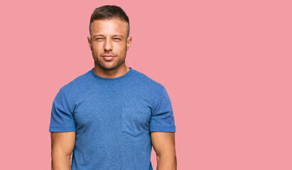 Obraz premium Handsome muscle man wearing casual clothes skeptic and nervous, frowning upset because of problem. negative person.