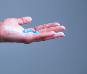 Beautiful female hand holds pill gesture. Hand pills. Virus. Vitamin. 