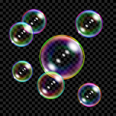 Set of several translucent colored soap bubbles on transparent background. Transparency only in vector format
