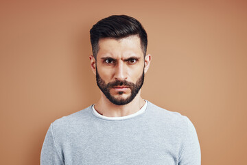 Frowning young man in casual wear