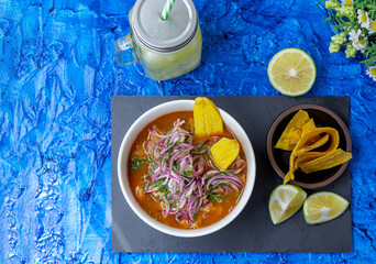Top view of an encebollado, a typical food from Ecuador prepared with fish, onion, lemon and yucca...