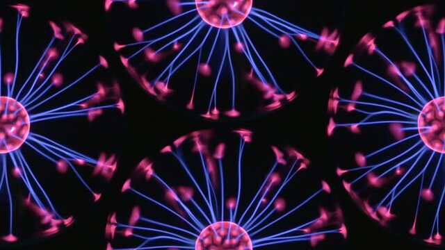 Four neon colors halves of plasma spheres lamps on black. Magic hypnotic lighting effect inside orbs. Mesmerizing background of balls and rays with blue and pink filaments. 4K UHD 4096x2304
