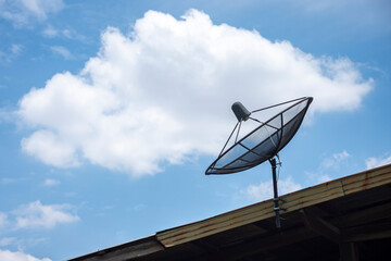 Satellite dish and sky background