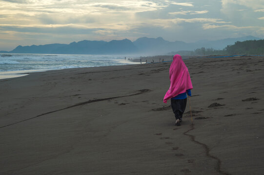 woman walking on the beach