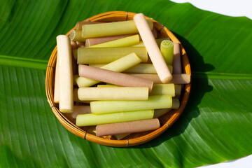 Lotus stems in bamboo basket on banana leaf