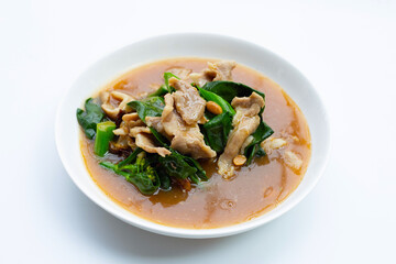 Fried flat noodle with pork and kale in gravy sauce