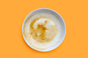 Dirty dish on orange background. Top view