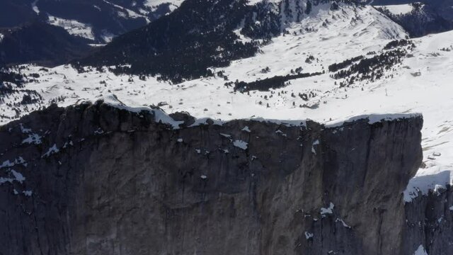 Aerial flight adove stunning Alps Cliffs. 
High mountain peaks sharp cliffs Dolomites, Italy
Drone view  from Italy Top Peaks 
