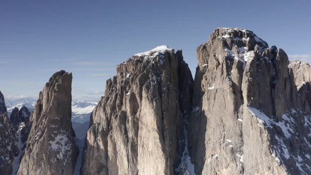 Aerial flight adove stunning Alps Cliffs. 
High mountain peaks sharp cliffs Dolomites, Italy
Drone view  from Italy Top Peaks 

