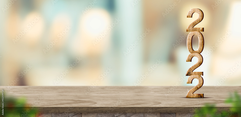 Poster new year 2022 (3d rendering) on brown wood table at blur abstract bokeh light home background with b