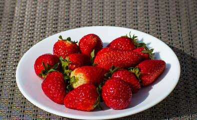 Plate of ripe juicy strawberries