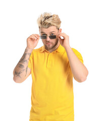 Fototapeta premium Young man with stylish sunglasses on white background