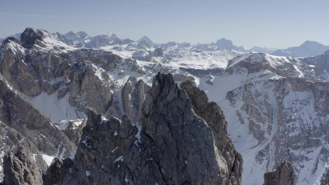 Aerial flight adove stunning Alps Cliffs. 
High mountain peaks sharp cliffs Dolomites, Italy
Drone view  from Italy Top Peaks 

