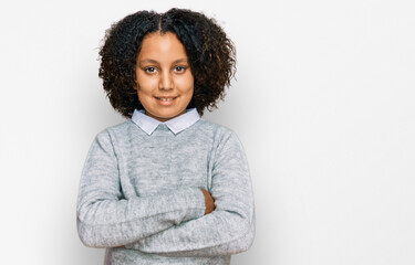 Young little girl with afro hair wearing casual clothes happy face smiling with crossed arms looking at the camera. positive person.
