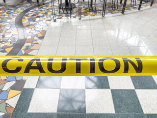 Yellow caution tape to close off restaurant area during shut down