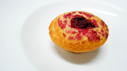  raspberry muffin on a white background