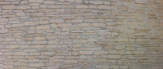 Pattern of decorative stone on the wall. House wall facade background