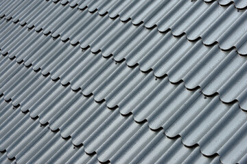 Metal roof with water drops after rain