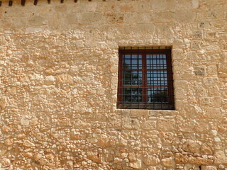 Retro photo of window with old lattice in vintage wall