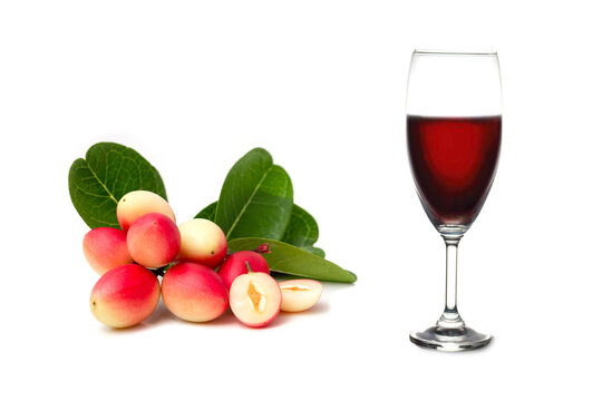 Herbal juice from Koromcha fruit - Karonda or Carissa carandas (Carissa Carandas Linn) isolate on white background