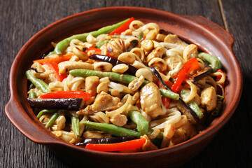 chicken satay rice noodle with veggies, top view