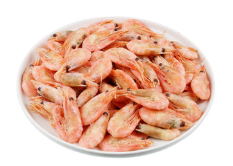 Plate with frozen small Norwegian prawns shrimps isolated