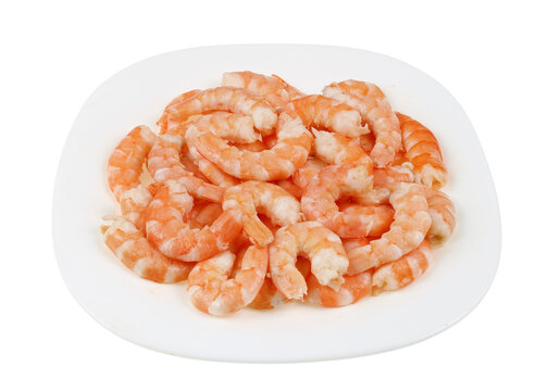 Peeled boiled shrimp meat on ceramic plate isolated