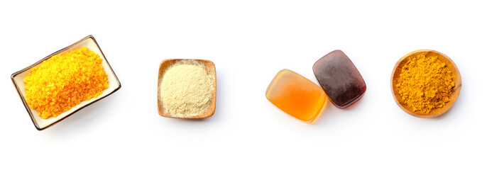 Collection of spa salt, thanaka powder, aroma soap and turmeric powder on white background