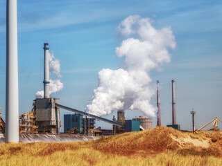 Steel factory with big chimneys in IJmuiden, the Netherlands - obrazy, fototapety, plakaty