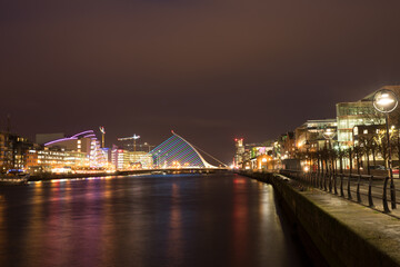Fototapeta na wymiar Ireland cityscape. A bridge with a harp motif, which is also an icon of Guinness beer
