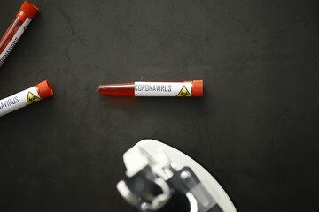 A blood sample for testing the dangerous virus coronavirus in the body. Test tubes with tests for coronavirus. Laboratory studies of viral diseases.