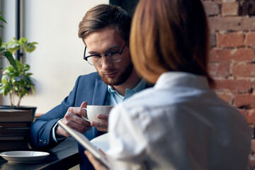 man and woman work colleagues communication fun leisure cafe