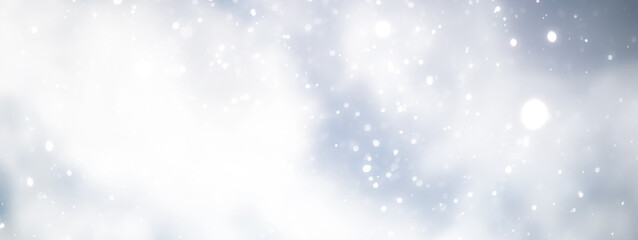Fototapeta premium blue snowfall bokeh background, abstract snowflake background on blurred abstract blue