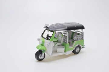 the scale of Thailand three wheel native taxi at board