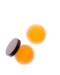 Cosmetic balm with honey ingredient in container isolated on white