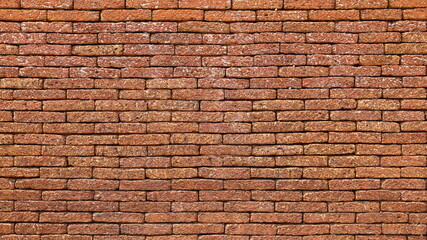 A reddish brown laterite brick wall. Attractive antique red brick wall texture for background designs with copy space. Selective focus