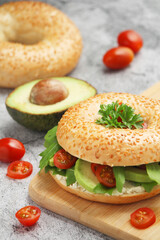 Sesame bagels with tomatoes and avocado