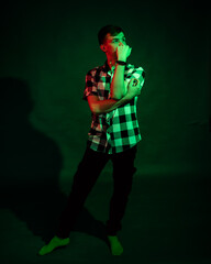 Emotional guy in the studio with green and red light