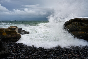 waves crashing on rocks