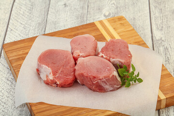 Raw pork medallion served rosemary