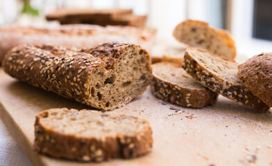 fresh loaf of bread on wooden board