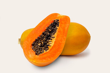 Ripe papaya fruit with half papaya isolated on white background.