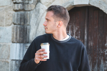 tourist man walking through the streets and having a coffee, travel concept