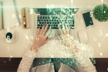 Double exposure of woman hands working on computer and data theme hologram drawing. Top View. Technology concept.