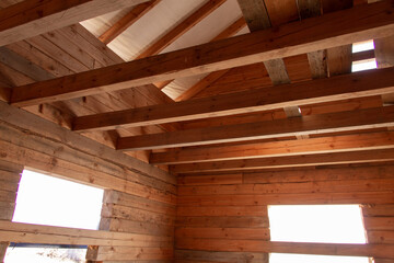 Construction site of an eco-friendly wooden house on a sunny day